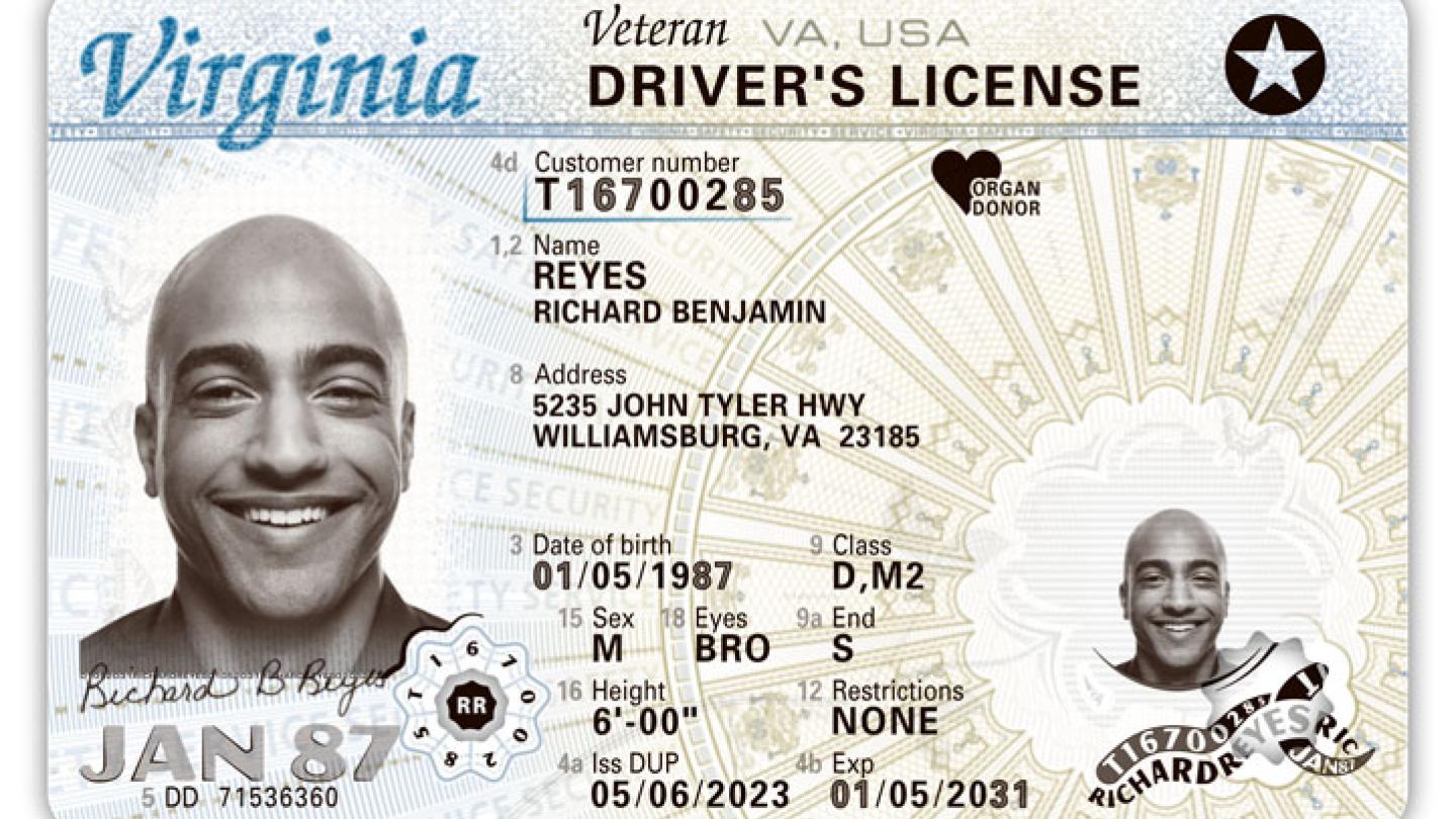 Sample Virginia driver's license showing a smiling bald black man.